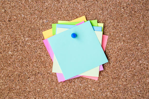 istock Collection of various note papers on corkboard 1802335368