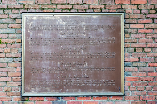 Sign on the wall of Paul Revere's Mall beside Old North Church, this sign gives details of Samuel Tucker, Increase Mather,Edward Holyoke, Edward Everett and Christian Gullager in Boston, Massachusetts, USA.