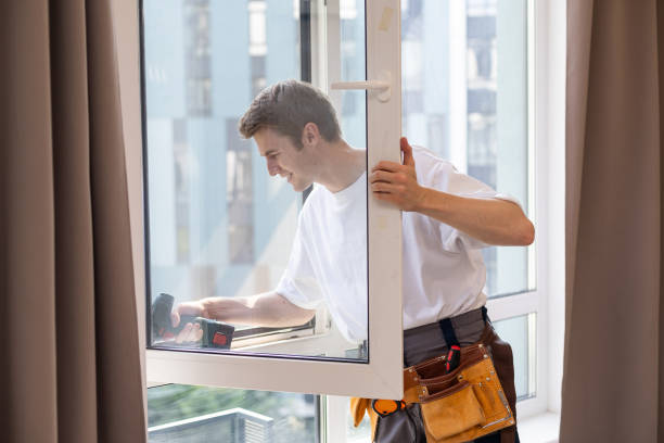 A repairman fixing windows in new apartment.