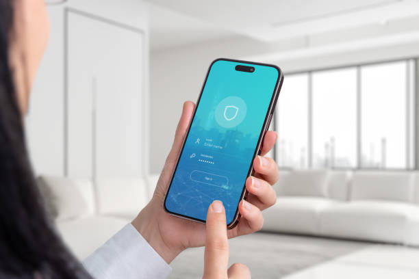 istock Woman holding a mobile phone displaying a login form. Explore concepts of connectivity, security, and seamless access in a digital world 1802363874