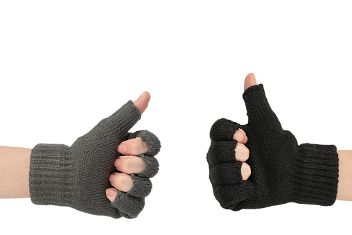 Woman hands in warm gloves isolated on a white background.