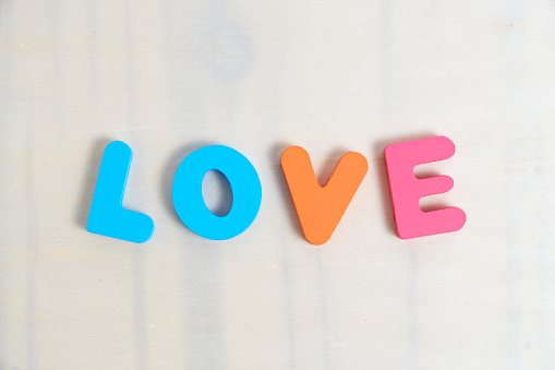 Word love is laid out in multicolored letters