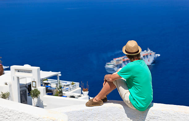 istock tourist looking at the sea in Santorini, 180237921