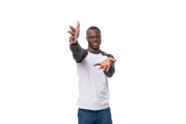 istock young african man with short haircut greets with hugs on studio background with copy space 1802384253