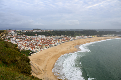 Nazaré is a picturesque coastal town in Portugal, known for its beautiful beaches and as a popular destination for surfers seeking giant waves. The photo was taken in Nov 2023.
