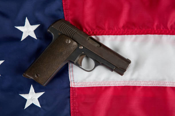 istock Historic World War II semi automatic pistol on American Flag 1802388054