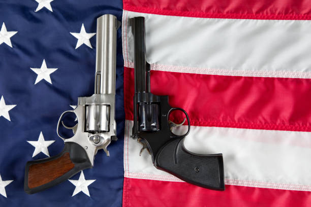 istock Revolvers on American Flag background 1802389117