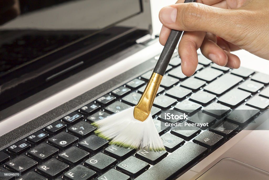 Cleaning computer Clean with brush. Cleaning Stock Photo