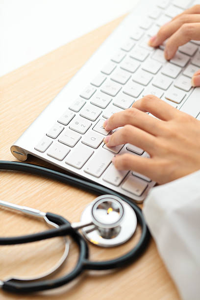 istock Doctor typing on keyboard with stethoscope 180240524