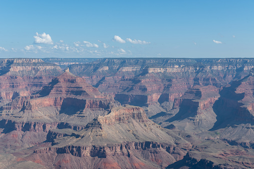 The Grand Canyon as seen from Mather Point on the South Rim of the canyon. Morning light shows the colored striations in the rock of the eastern canyon walls while casting strong shadows to the west.