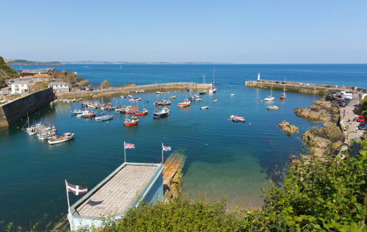 Mevagissey harbour Cornwall England blue sea and sky on a beautiful summer day