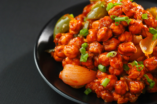 Chilli chana typically refers to a spicy and flavorful Indian dish made with chickpeas (chana) and a spicy chilli-based sauce.