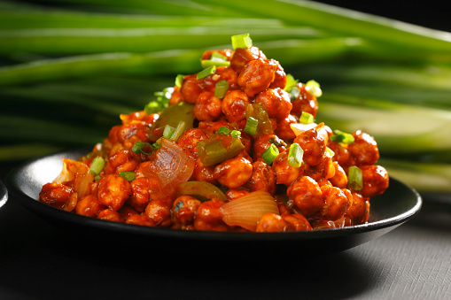 Chilli chana typically refers to a spicy and flavorful Indian dish made with chickpeas (chana) and a spicy chilli-based sauce.