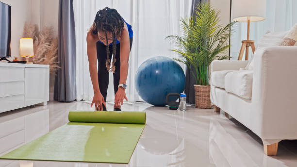 istock Woman preparing and stretching during her workout at home 1802438686