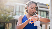 Woman using smart watch before running
