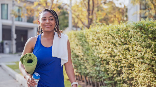 istock Happy woman walking to park for workout 1802438697