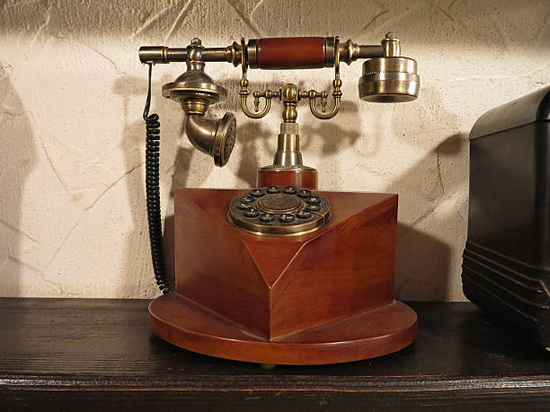 istock Vintage old style wooden phone with retro disc dial 180244941