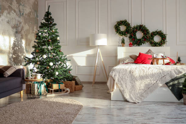 istock Bed with New Year's decorations. New Year's interior. Christmas tree 1802466105