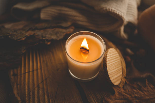 istock Burning candle in home interior, autumn aesthetics 1802472694