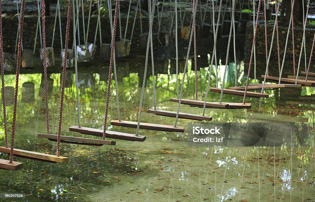 suspension bridge suspension bridge across water Adventure Stock Photo