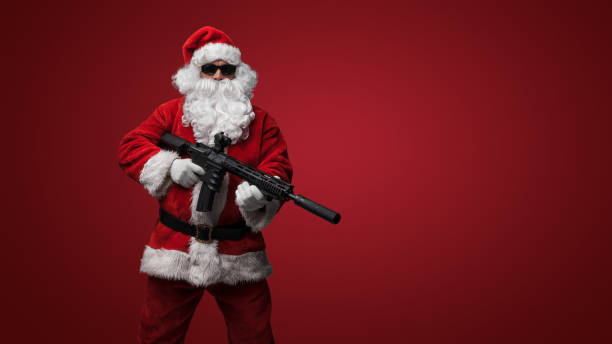 istock Santa Claus with Toy Machine Gun 1802475950