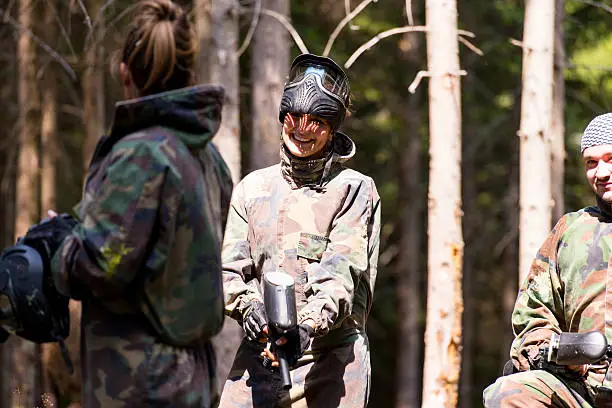 Photo of Paintball player resting and smiling