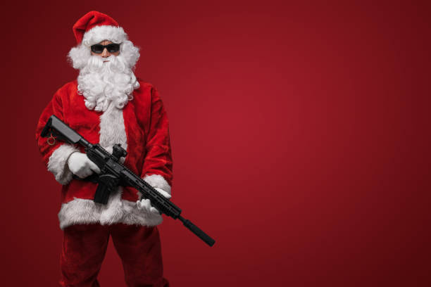 istock Santa Claus with Toy Machine Gun 1802484476