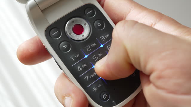 Using an old-fashioned push-button flip mobile phone