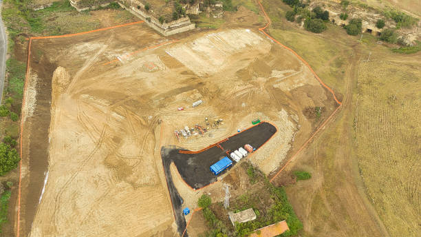 istock Earthmoving equipment. Aerial view of a large construction site with several earthmoving machines. 1802487630