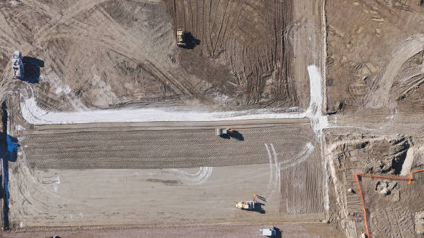 istock Earthmoving equipment. Aerial view of a large construction site with several earthmoving machines. 1802490357