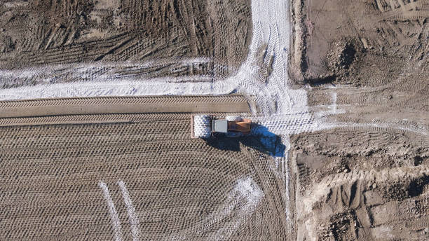 istock Earthmoving equipment. Aerial view of a large construction site with several earthmoving machines. 1802490377