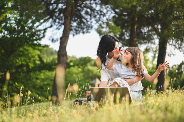 istock young family having fun in a green meadow. 1802491494