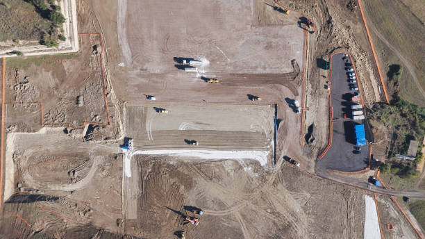 istock Earthmoving equipment. Aerial view of a large construction site with several earthmoving machines. 1802491521