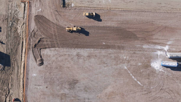 istock Earthmoving equipment. Aerial view of a large construction site with several earthmoving machines. 1802491523