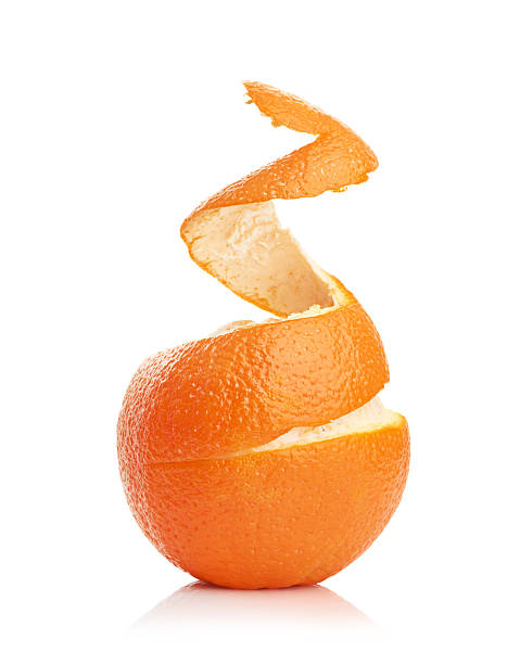 istock orange with peeled spiral skin 180250684