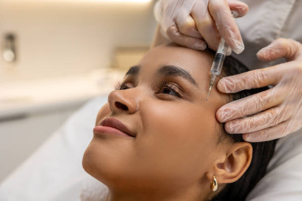 istock Smiling woman on a mesotherapy treatment session 1802508884