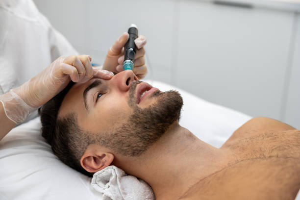 istock Man having cosmetological procedures in a beauty clinic 1802509404