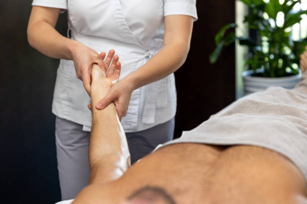 istock Young man lying on a couch and having procedures in a beauty salon 1802510033