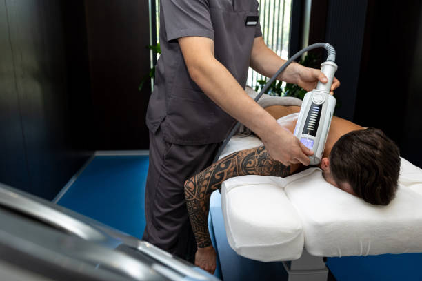 istock Young man having rehabilitation procedures in a clinic 1802510533