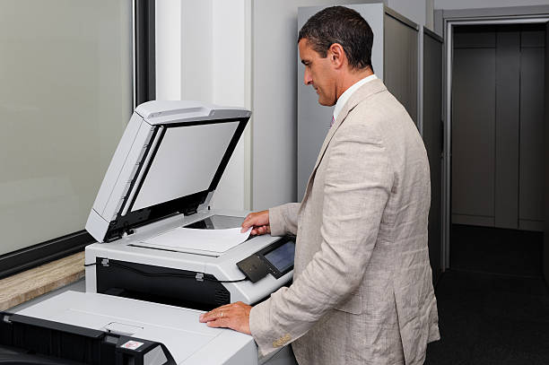 istock Businessman doing a photocopy 180252514