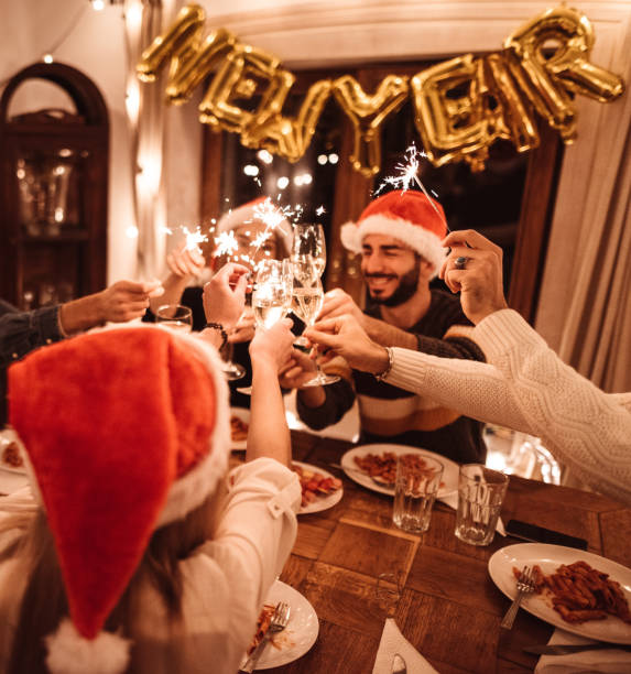 istock friends toasting at home for christmas 1802531501