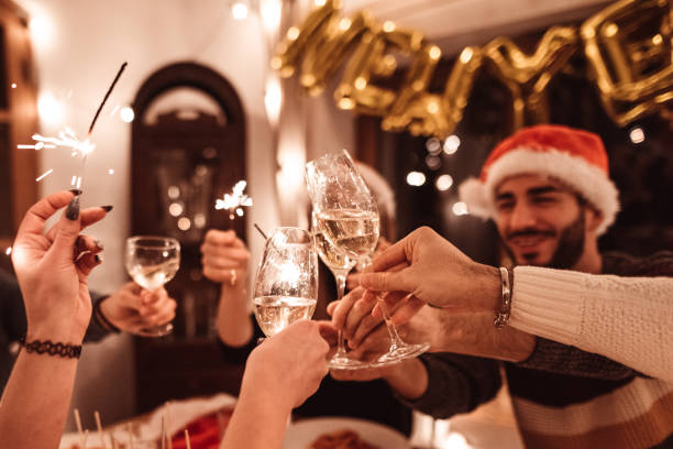 istock friends toasting at home for christmas 1802532559