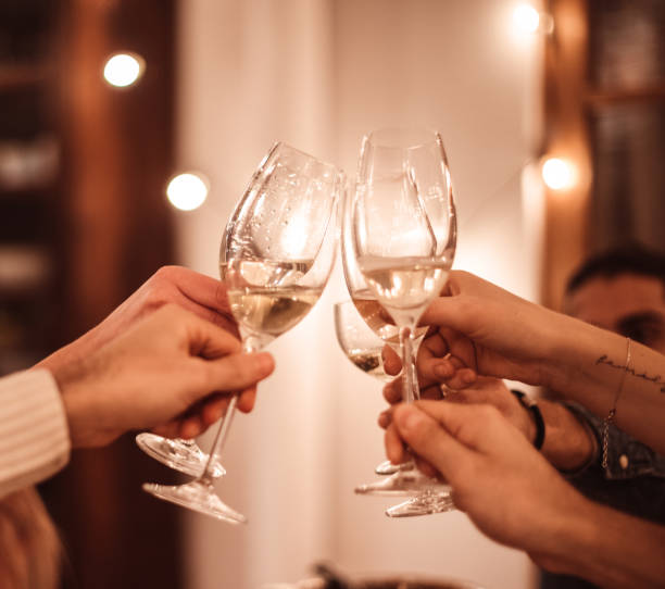 istock friends toasting at home for christmas 1802534146