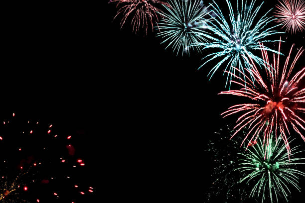 istock Festive black background for new year design with real fireworks and sparks, copy space 1802535241
