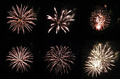 Set with golden festive real firework round shapes on black background for overlay blending mode of yours design project