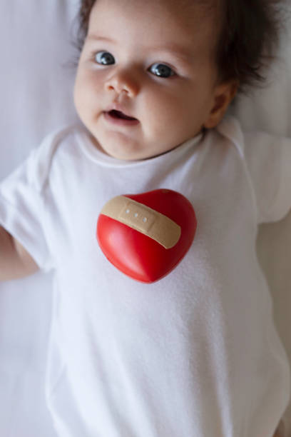 istock Baby with red heart 1802539477