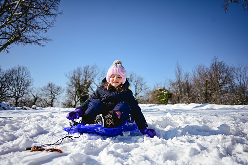 Cute little girl enjoying winter day outdoors.
