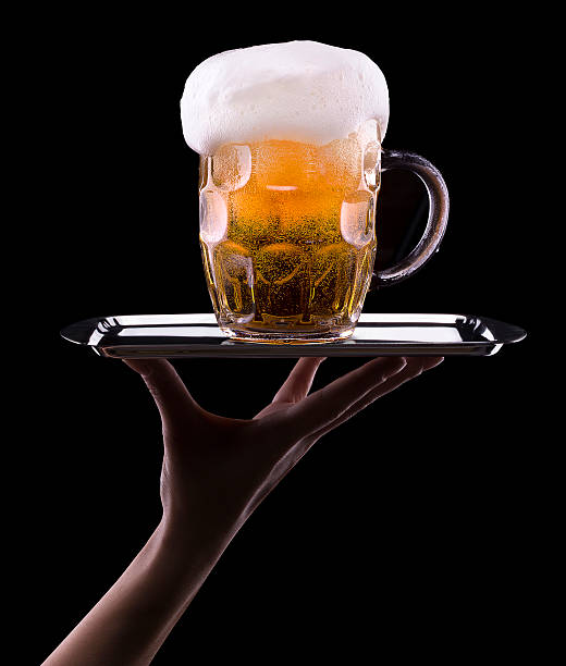 istock Frosty glass of light beer on black background 180255641
