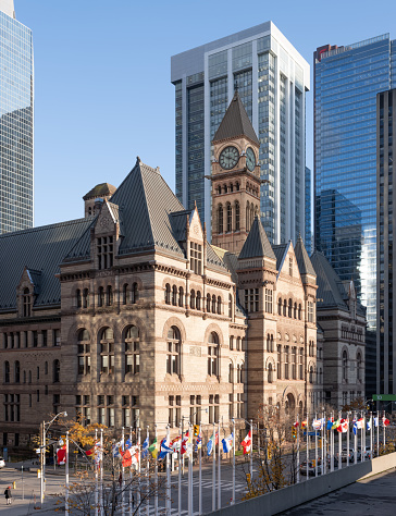 Toronto, Canada - July 22, 2014: Casa Loma gothic castle and museum with fountain and canadian flag