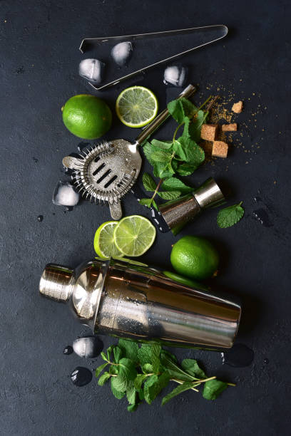 istock Ingredients for making mojito - delicious lime cocktail with mint. Top view with copy space. 1802568610